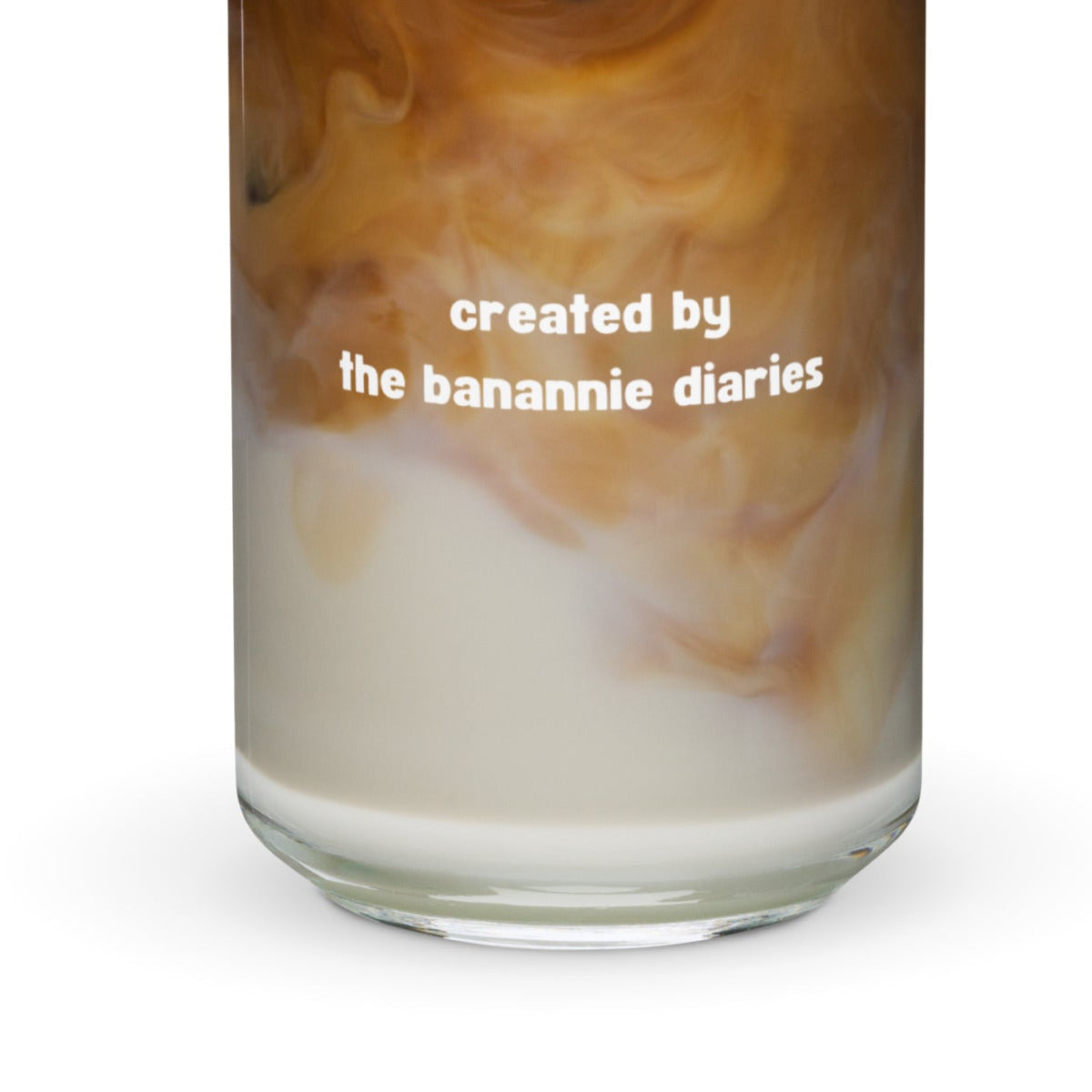 Glass with coffee and milk swirl and 'created by the banannie diaries' text