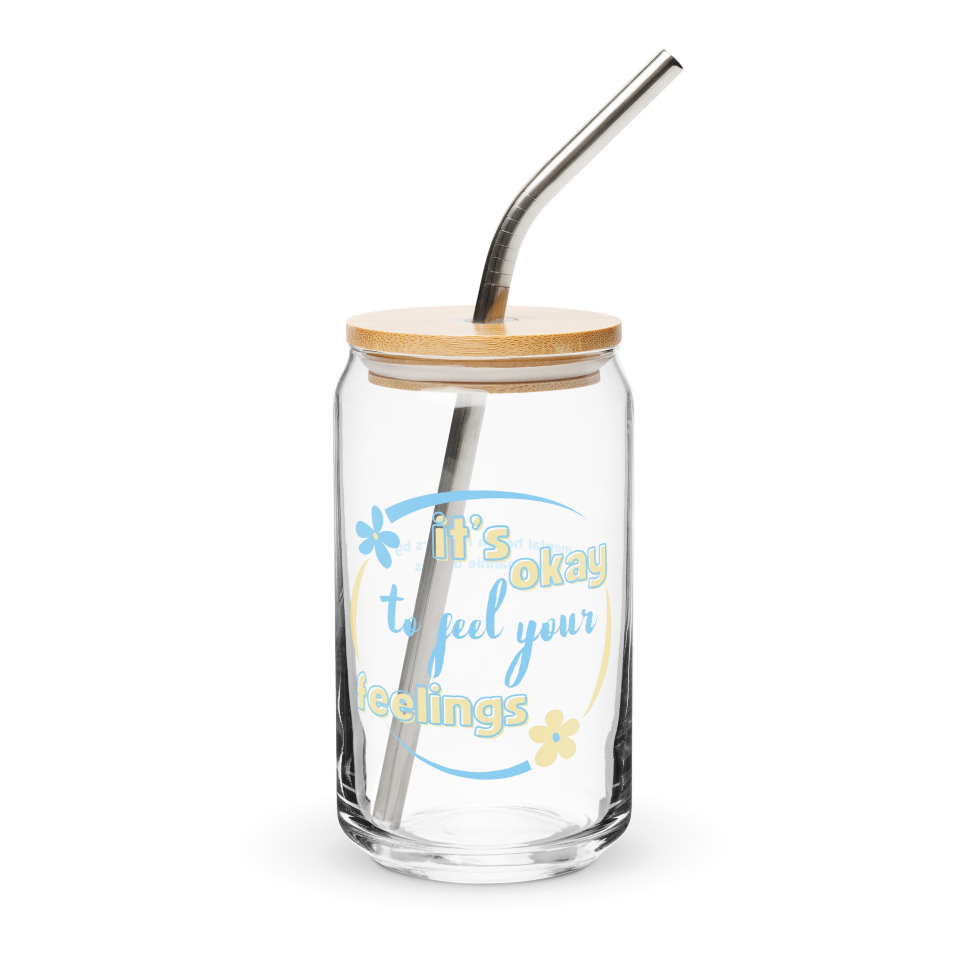 A clear glass can-shaped drinking glass with a wooden lid and a stainless steel straw, featuring an affirmation text.