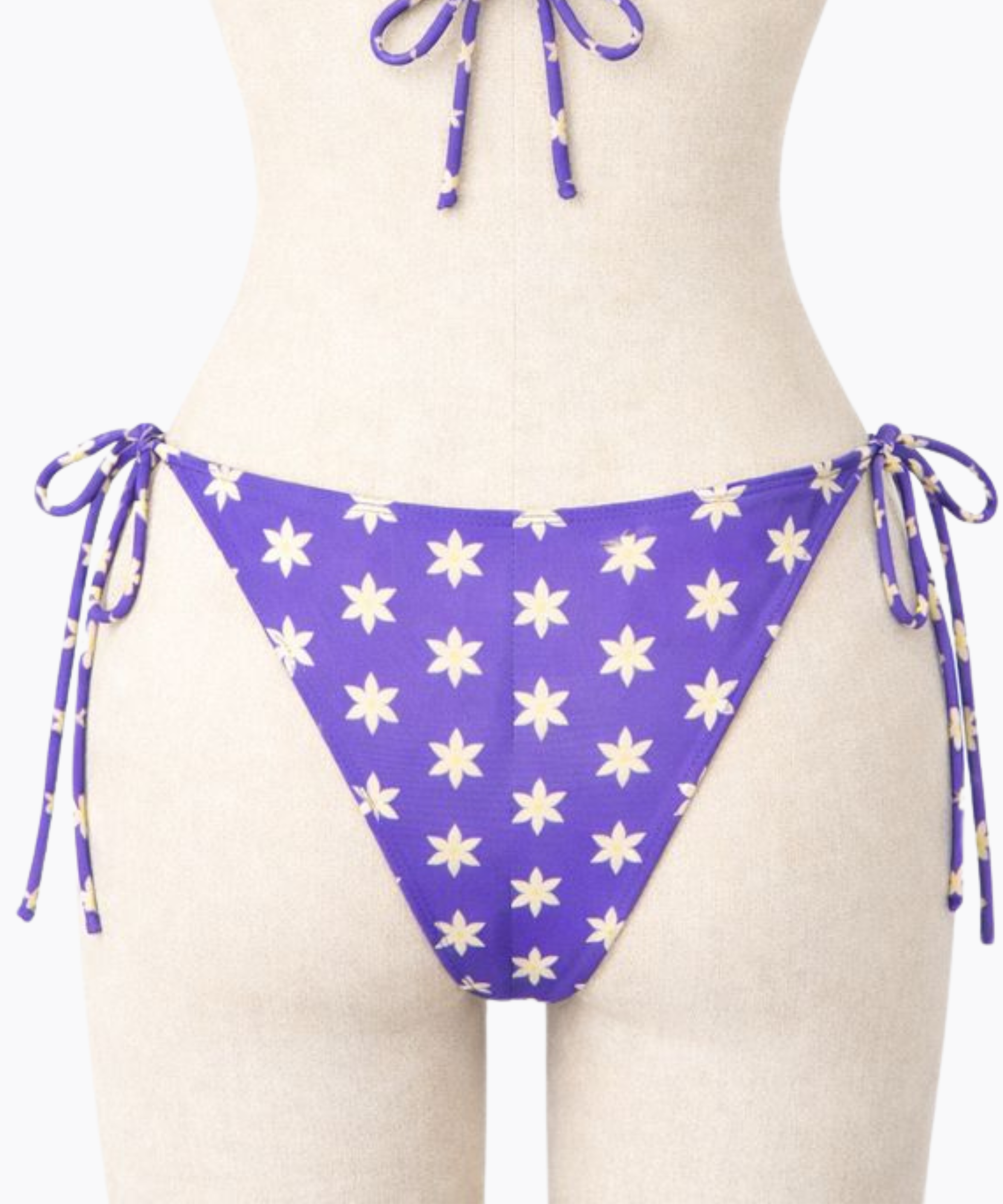 Back of purple bikini bottom with a light yellow floral pattern on a mannequin against a white background