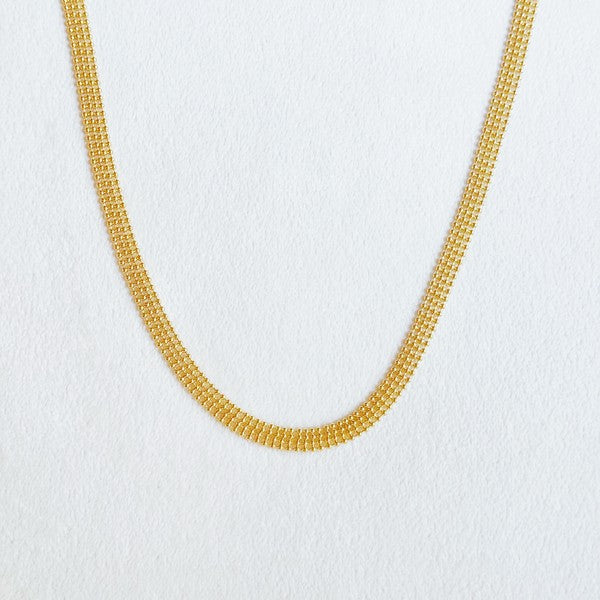 Elevate your style with the Tied in Gold Choker-Style Necklace by Ellison and Young. Featuring a delicate gold chain complemented by a chic black velvety ribbon tie, this versatile accessory adds a touch of elegance to any outfit. Perfect for day-to-night transitions, it effortlessly blends timeless sophistication with modern flair.
