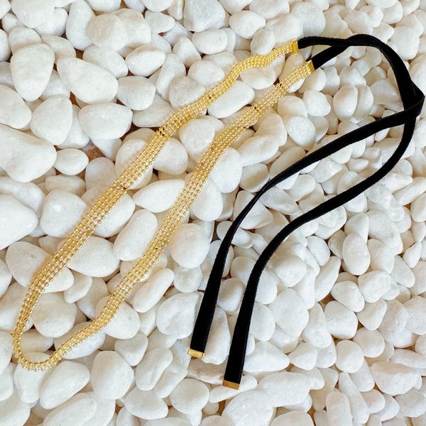 Elevate your style with the Tied in Gold Choker-Style Necklace by Ellison and Young. Featuring a delicate gold chain complemented by a chic black velvety ribbon tie, this versatile accessory adds a touch of elegance to any outfit. Perfect for day-to-night transitions, it effortlessly blends timeless sophistication with modern flair.
