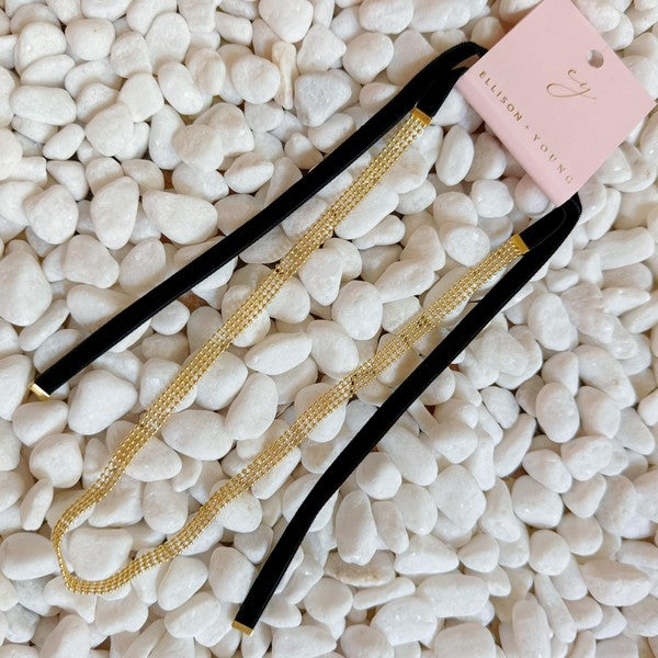 Elevate your style with the Tied in Gold Choker-Style Necklace by Ellison and Young. Featuring a delicate gold chain complemented by a chic black velvety ribbon tie, this versatile accessory adds a touch of elegance to any outfit. Perfect for day-to-night transitions, it effortlessly blends timeless sophistication with modern flair.
