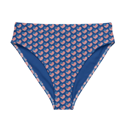 Discover the American Hearts Recycled High-Waisted Bikini Bottom, crafted for both comfort and sustainability. This eco-conscious design features a double-layered construction for added support and a flattering silhouette. Pair it seamlessly with our matching top for a coordinated beach ensemble or a laid-back day at the spa.  - Double-layered for extra support - Tear-away care label