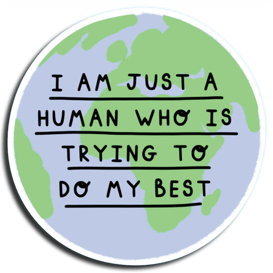 A round vinyl sticker with a white text message saying 'I am just a human who is trying to do my best' surrounded by a green die-cut shape of the Earth.